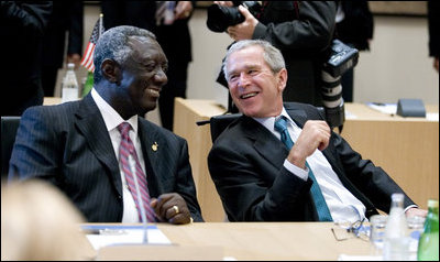 President George W. Bush shares a moment with President John Agyekum Kufuor of Ghana prior to the start Monday, July 7, 2008, of the G8 Working Session with Africa Outreach Representatives in Toyako, Japan.