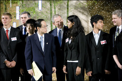 President George W. Bush and Japanese Prime Minister Yasuo Fukuda speak with United States J-8 representative Manogna Manne of Pleasanton, Calif., a member of the J-8 young leaders from the Group of Eight countries, attending the 2008 G-8 Summit in Toyako, Japan.