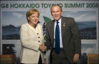 President George W. Bush and Germany's Chancellor Angela Merkel shake hands after meeting Tuesday, July 8, 2008, at the G-8 Summit in Toyako, Japan.