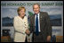 President George W. Bush and Germany's Chancellor Angela Merkel shake hands after meeting Tuesday, July 8, 2008, at the G-8 Summit in Toyako, Japan.
