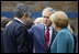 President George W. Bush speaks with Prime Minister Gordon Brown, United Kingdom, and Chancellor Angela Merkel, Germany, during the final day of the G-8 Summit Wednesday, July 9, 2008, in Toyako, Japan.