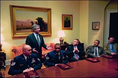 Chief of Staff Andy Card talks with military personnel in the Roosevelt Room Feb. 2, 2004.