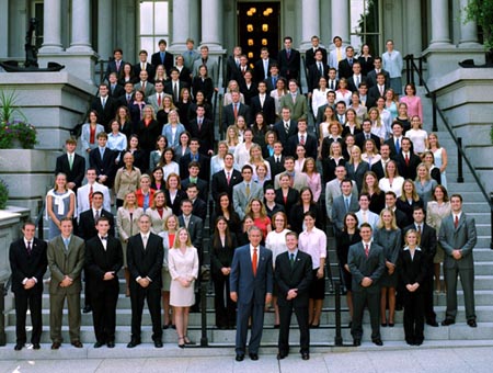 Photo of President George W. Bush with the 2003 White House Summer Interns. White House photo by Tina Hager.
