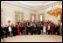 President George W. Bush and Vice President Dick Cheney pose with the Spring 2005 class of White House Interns in the State Dining Room April 28, 2005.