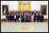 President George W. Bush and Vice President Dick Cheney pose with the Spring 2008 White House Interns in the East Room, April 28, 2008.