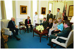Vice President Dick Cheney visits with a group of White House Interns in his office July 16, 2004.