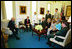 Vice President Dick Cheney visits with a group of White House Interns in his office July 16, 2004.