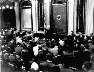 Photo of President Eisenhower holding the first televised presidential press conference in the Indian Treaty Room in January, 1955