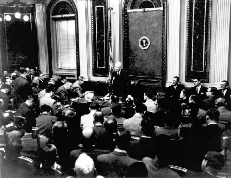 Photo of President Eisenhower holding the first televised presidential press conference in the Indian Treaty Room in January, 1955