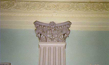 Photo showing the detail of a cast iron pilaster with moulding on the ceiling (1991, Office of Administration, EOP)