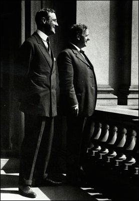 Assistant Secretary of the Navy Franklin Delano Roosevelt (left), and Secretary of the Navy Josephus Daniels (right) in May of 1918 on the balcony between their offices in rooms 278 and 274 respectively.