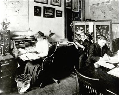 Shown here in May 1910 sitting in room 341, are Mabel Boardman (left), President of the American Red Cross, and clerks Francis Mulhall (center), and Charles Magee (right).From this office between 1905 to 1914, the American Red Cross responded to regional and national disasters such as the San Franscisco earthquake in 1906, the New York City Triangle Shirtwaist Company fire in 1911, and the sinking of the R.M.S. Titanic in 1912.