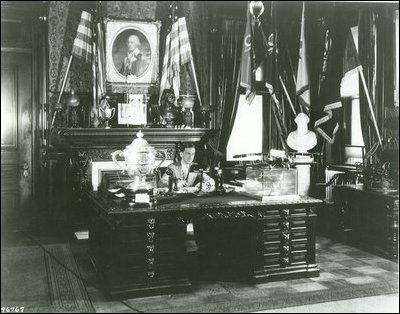 Clerk John Schott at the desk in the Secretary of War's Reception Room in 1932. 