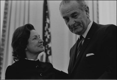 Former First Lady Lady Bird Johnson with President Lyndon B. Johnson at the signing of the Interior Department Appropriation Bill in the Oval Office Sept. 26, 1968. LBJ Library Photo by Yoichi Okamoto 