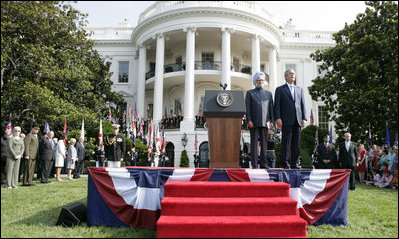 President Bush stands with India's Prime Minister Dr. Manmohan Singh, Monday, July 18, 2005 during the playing of the national anthems on the South Lawn of the White House. 