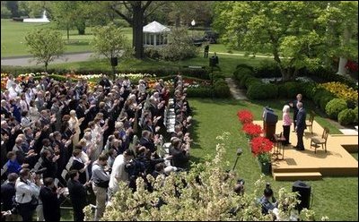 President George W. Bush and First Lady Mrs. Laura Bush with Kathleen Mellor the 2004 Teacher of the Year from South Kingstown, Rhode Island in the Rose Garden of the White House on April 21, 2004.