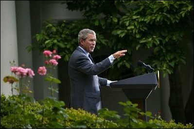 President George W. Bush welcomes the new members of Iraq's interim government during a statement in the Rose Garden Tuesday, June 1, 2004. The U.S.-led Coalition Provisional Authority will transfer sovereignty to Iraq's Interim President Sheikh Ghazi al-Yawar and Interim Prime Minister Iyad Allawi on June 30. 