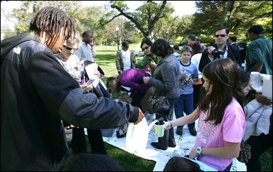 Children participate in the First Bloom activities Sunday, Oct. 19, 2008, during the Fall Garden Tour at the White House. The First Bloom event encourages kids to get involved with conserving America's National Parks.