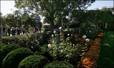 Visitors take photos of the Rose Garden Sunday, Oct. 19, 2008, during the annual Fall Garden Tour of the White House.