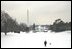 The President takes a walk in the snow on the South Lawn with his dog, Spot, Thursday, Dec. 5, 2002.