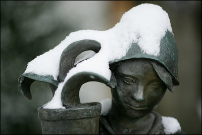 A White House East Garden fountain figurine is seen under a light cover of snow Monday morning, Jan. 22, 2007, the result of Sunday’s snowstorm that blanketed the Washington, D.C. area.