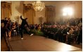 President George W. Bush and Laura Bush watch the performance of Joaquin Cortes as he dances to a quintet of Flamenco musicians during a Hispanic Heritage Month celebration in the East Room of the White House Wednesday, Sept. 15, 2004.