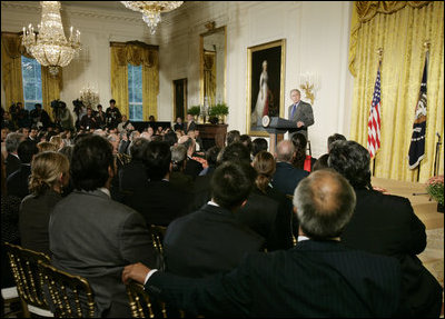 President George W. Bush welcomes invited guests Friday, Oct. 6, 2006 to the East Room of the White House, as part the festivities in celebration of National Hispanic Heritage Month.