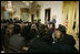 President George W. Bush welcomes invited guests Friday, Oct. 6, 2006 to the East Room of the White House, as part the festivities in celebration of National Hispanic Heritage Month.