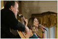 Singer Ana Cristina and guitarist Marco Linares perform on stage Friday, Oct. 6, 2006, in the East Room of the White House, in celebration of National Hispanic Heritage Month.