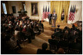 President George W. Bush delivers remarks in the East Room of the White House, Friday, Oct. 7, 2005, where he honors six recipients of the President's Volunteer Service Awards, as part of the celebration of Hispanic Heritage Month.
