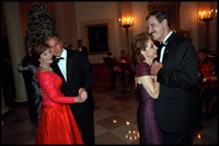Leading their wives in the first dance of the evening, Presidents Bush and Mexican President Vicente Fox take to the floor during the state dinner held on September 5, 2001.