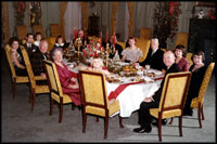 President and Mrs. Eisenhower are all smiles as they host a 1960 Christmas Party in the State Dining Room.