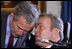 President George W. Bush speaks with NYPD Officer Steve McDonald in the Blue Room April 10, 2002. 
