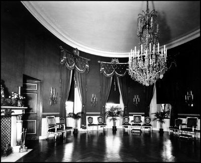 Ferns and blue drapes decorated the Blue Room during the Herbert Hoover administration, 1929-1933. Nearly a century before, the Blue Room received its name from President Martin Van Buren.