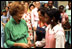 Rosalynn Carter greets young White House visitors in the Blue Room August 4, 1978.