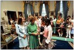 Rosalynn Carter greets young White House visitors in the Blue Room August 4, 1978.