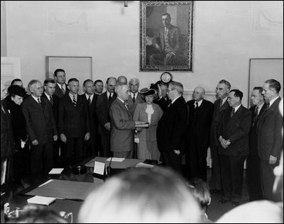 Within hours of President Franklin Roosevelt's death, Vice President Harry Truman takes the oath of office in a brief ceremony in the Cabinet Room April 12, 1945.