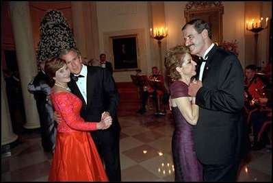 Leading their wives in the first dance of the evening, Presidents Bush and Mexican President Vicente Fox take to the floor during the state dinner held on September 5, 2001.