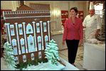 In the China Room, Laura Bush takes a sneak preview at White House Pastry Chef Roland Mesnier's gingerbread creation Dec. 2, 2001. Built from more than 80 pounds of gingerbread, it is a re-creation of the original White House as it appeared in 1800 when John Adams became the first resident. 