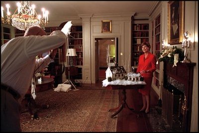 Laura Bush poses in the Map Room for a Family Circle article featuring the White House's 2001 holiday decorations Sept. 10, 2001. 