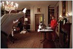 Laura Bush poses in the Map Room for a Family Circle article featuring the White House’s 2001 holiday decorations Sept. 10, 2001. 