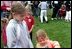 Four-year-old Lexi Rhem pets a magician's bunny while her sister, 10-year-old Monica Ollander, looks on. They were among thousands of children who took part in a 125-year-old American tradition April 21 - the White House Easter Egg Roll. 