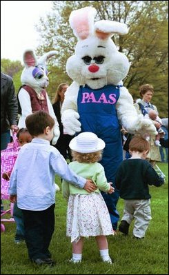 Greeting children between their activities, the Easter Bunny and friends hug and shake hands during the White House Easter Egg Roll Monday, April 21, 2003. 