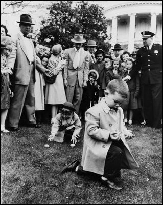The grandchildren of President Eisenhower, David and Anne, roll eggs on the South Lawn of The White House in 1953, the same year the Egg Roll was reintroduced as White House tradition. 