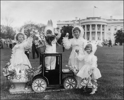Children dressed in bunny ears pose at the 1958 Easter Egg Roll on the South Lawn. 