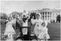 Children dressed in bunny ears pose at the 1958 Easter Egg Roll on the South Lawn. 