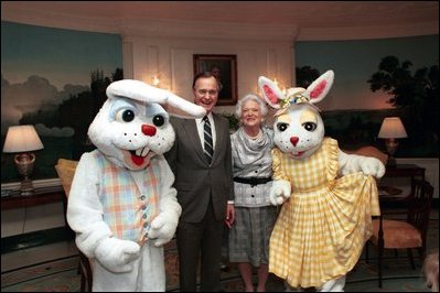 Former President Bush and First Lady Barbara Bush pose with Easter bunnies at The White House in 1989. The White House Easter Bunny, usually a White House staffer dressed in a special White House rabbit suit, was introduced by Pat Nixon, wife of President Richard Nixon, in 1969.