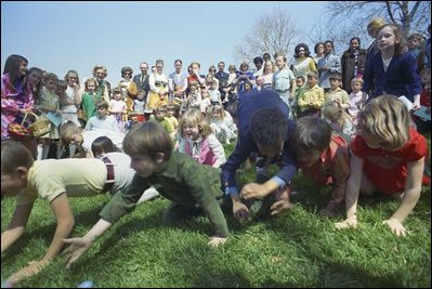 Children scramble to the finish line at the 1971 Easter Egg Roll on the South Lawn of the White House. The White House lawn became the "official" home of the egg roll when President and Mrs. Hayes offered their backyard in 1878.