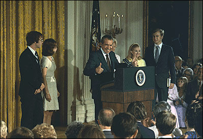 Surrounded by his family and staff, President Richard Nixon says goodbye as he leaves office August 9, 1974. 