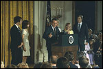 Surrounded by his family and staff, President Richard Nixon says goodbye as he leaves office August 9, 1974.